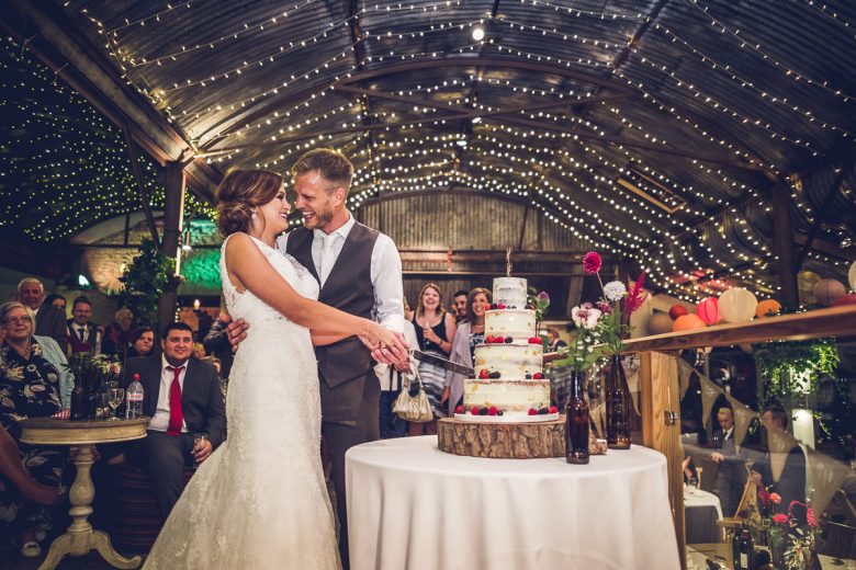 Cripps Stone Barn cutting wedding cake